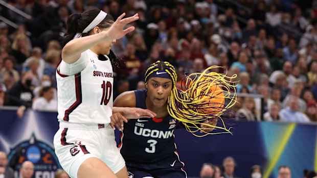 UConn Huskies forward Aaliyah Edwards dribbles the ball against South Carolina Gamecocks center Kamilla Cardoso